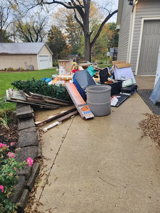 Dumpster being loaded with debris for 3 Yard Dumpster Rental in Exeter